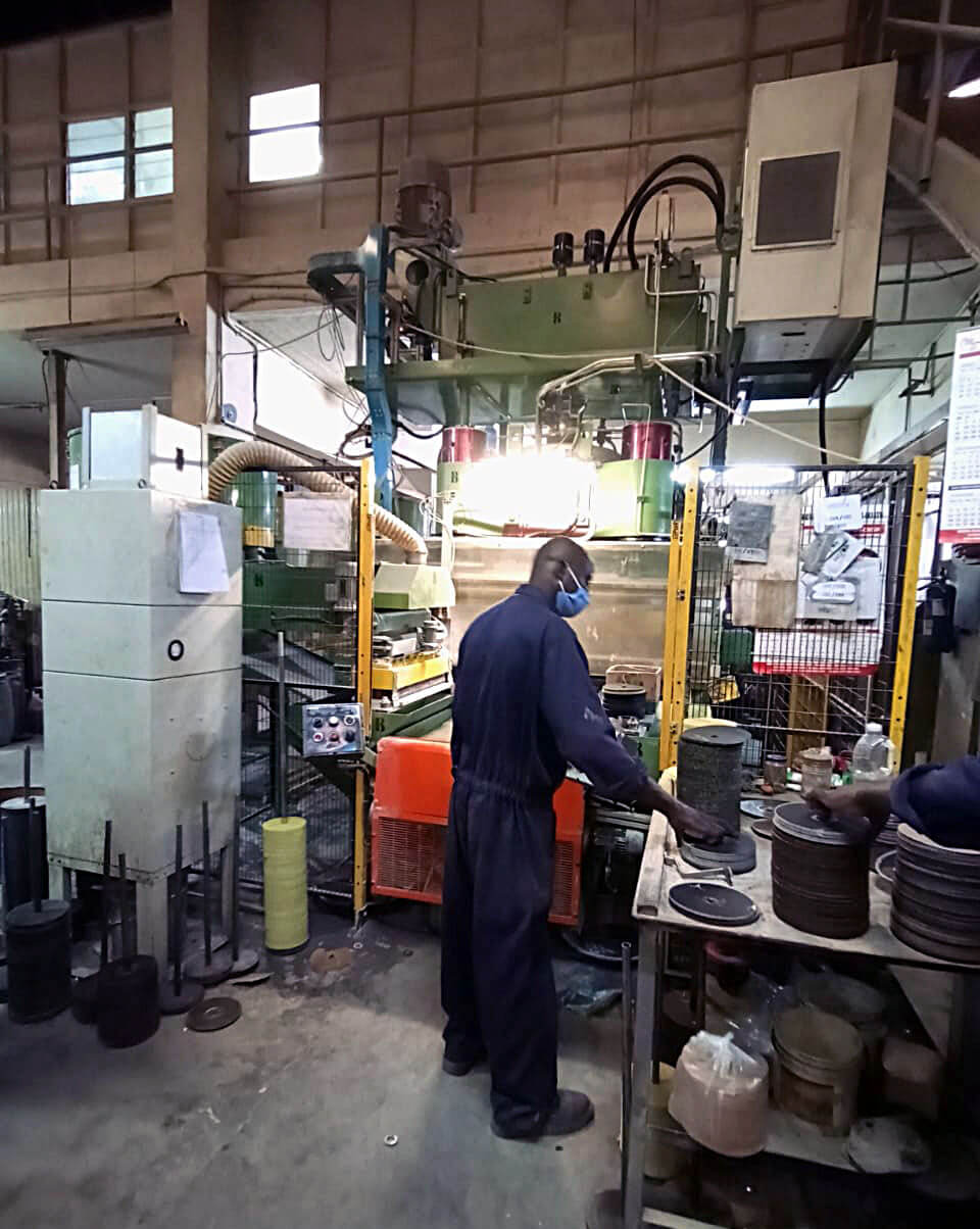 Worker in Vetrified Manufacturing Process